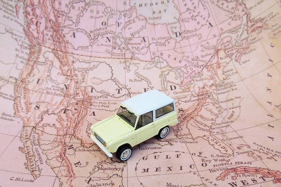 Family Road Trip Movies Toy Car Sitting on a Paper Map