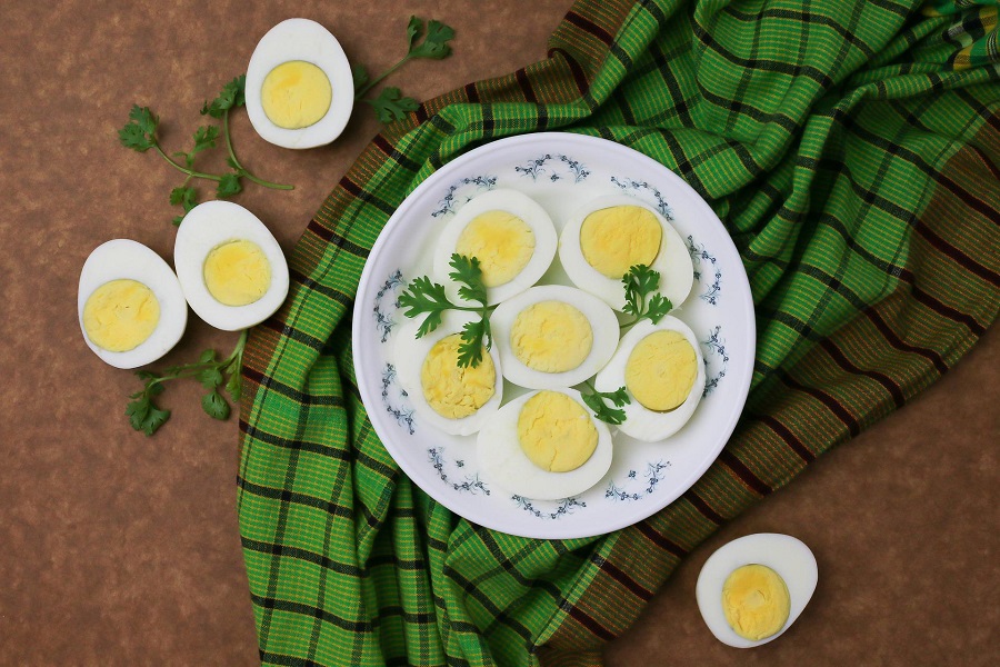 Snacks for Weight Loss to Carry with You Overhead View of a Plate of Hard Boiled Eggs Cut in Half