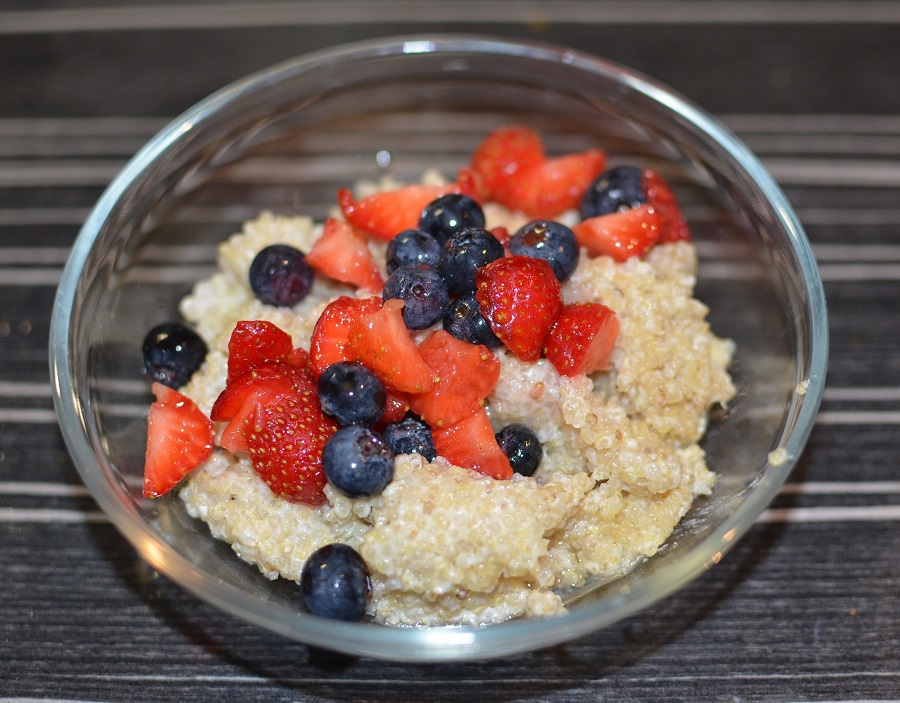 Quinoa Breakfast Recipes Overhead View of a Bowl of Quinoa with Sliced Fruit