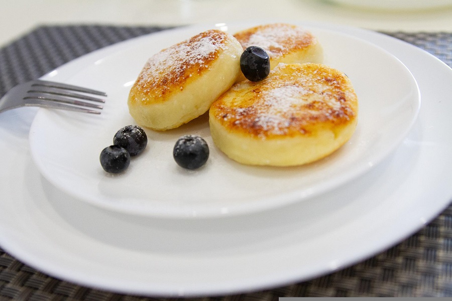 Low Carb Breakfast Ideas to Start your Day Close Up of Protein Pancakes with Blueberries