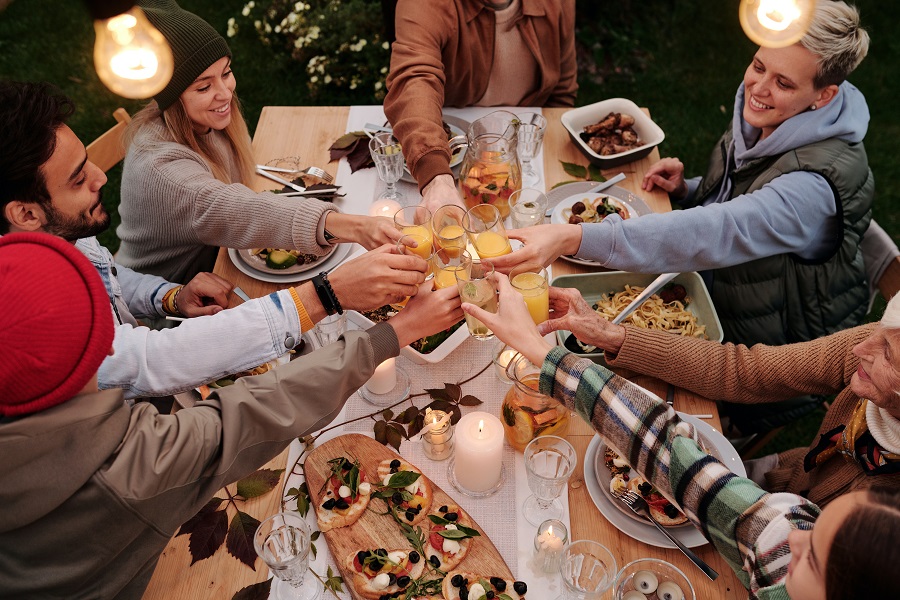 Thanksgiving Appetizers Close Up of People Toasting at a Thanksgiving Dinner Party