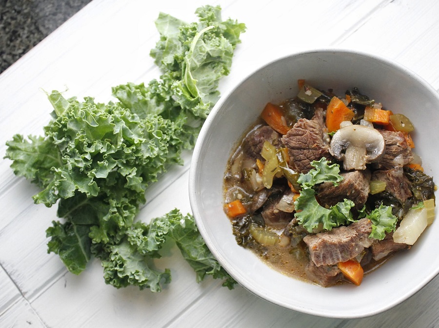 Whole30 Dinner Recipes for Weight Loss Overhead View of a Bowl of Beef Stew with Kale on the Side