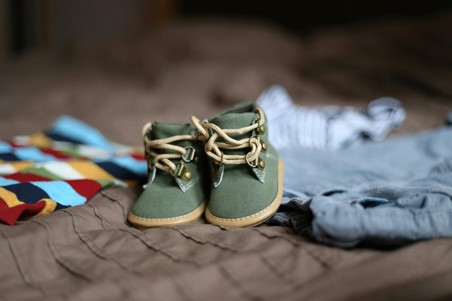 Baby Boy Gift Ideas Close Up of Very Small Boys Shoes with Clothes