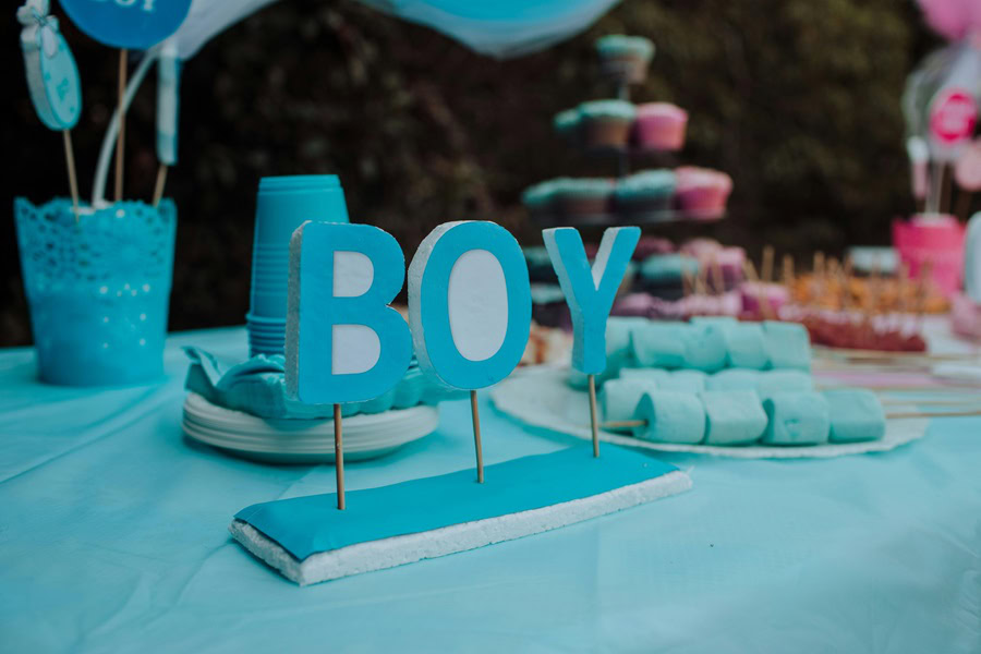 Baby Boy Gift Ideas a Table of Desserts at a Baby Shower with a "Boy" Sign