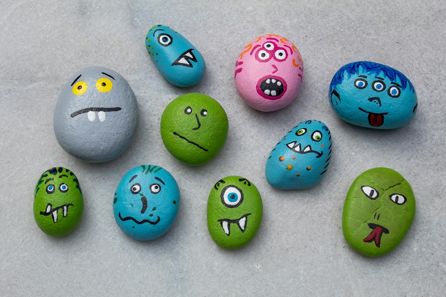 Painted Rocks Quotes and Rock Ideas to Inspire Close Up of Rocks with Painted Faces on Them