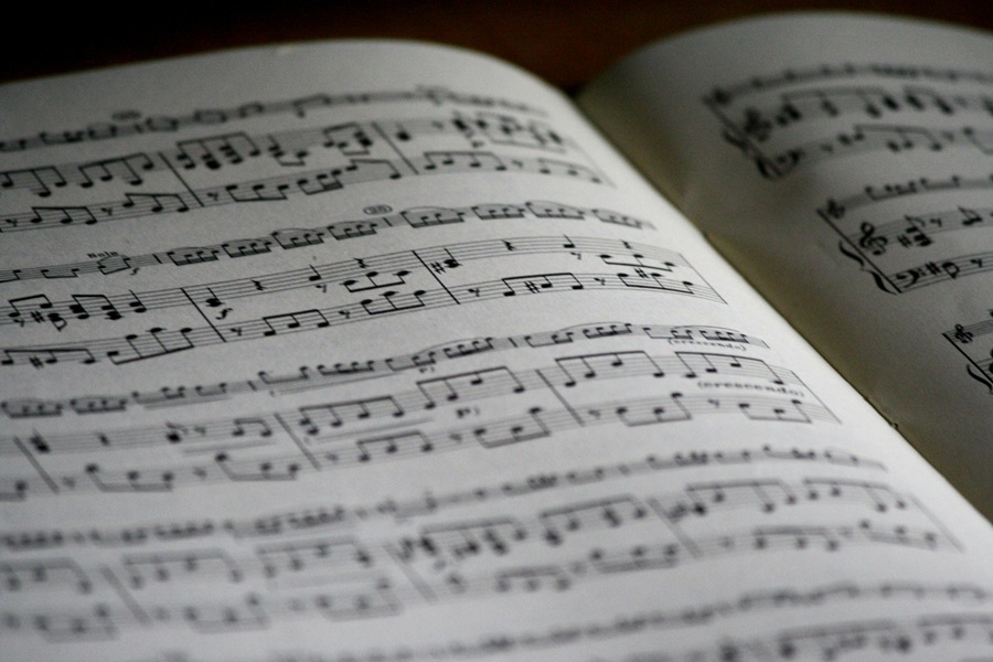 10 Songs to Listen to When you Want to Make a Deal Close Up of Sheet Music