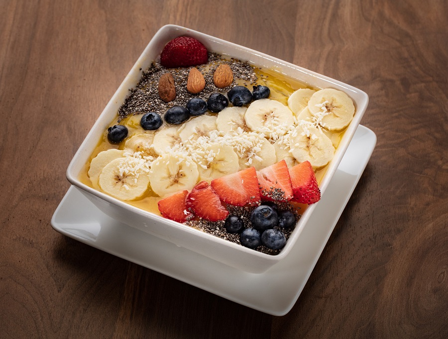 Healthy Smoothie Bowl Breakfast Recipes Overhead View of a Smoothie Bowl with Sliced Fruit On Top