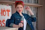 Ways to Wear a Jean Jacket Woman Wearing a Jean Jacket Holding a Soda with a Red Bandana in Her Hair