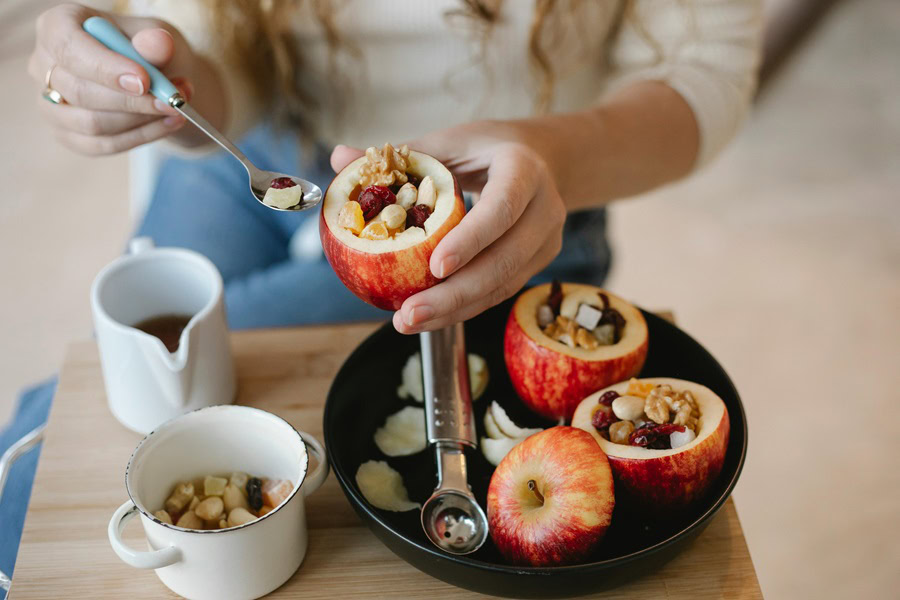 Apple Dessert Recipes a Woman Making baked Apples in a Kitchen