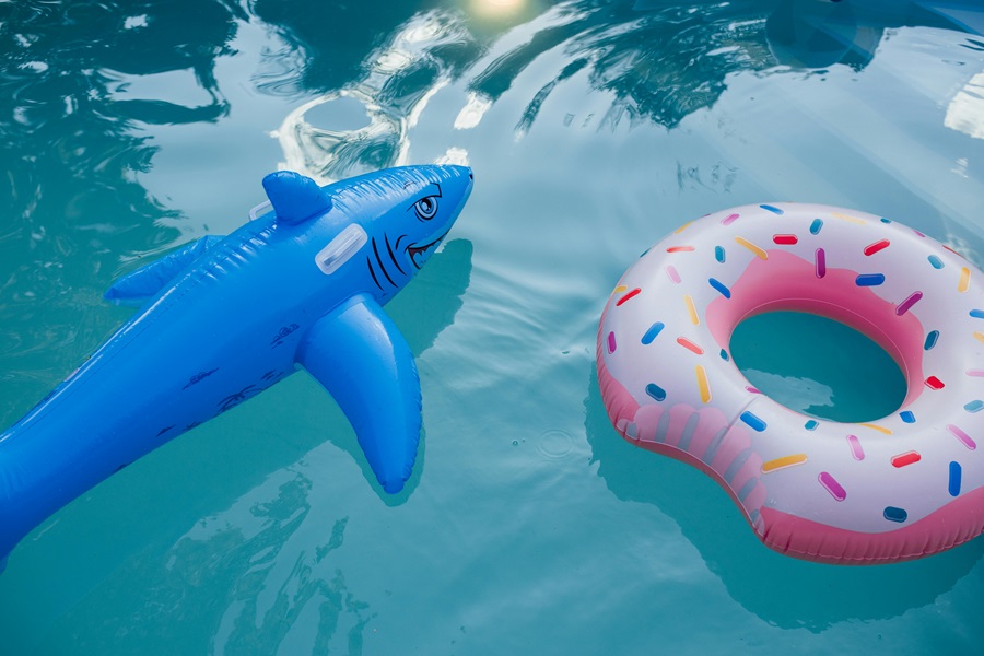Shark Week Desserts a Pool with Blow Up Shark and Blow Up Donut Floaties