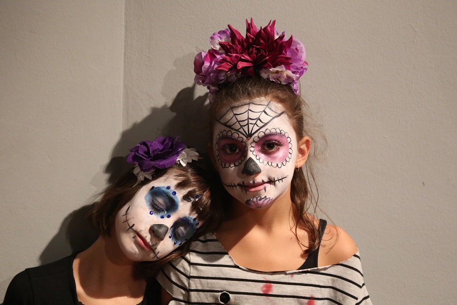 Fun Halloween Party Food Ideas for Kids Two Girls with Dia de los Muertos Make Up on Their Faces