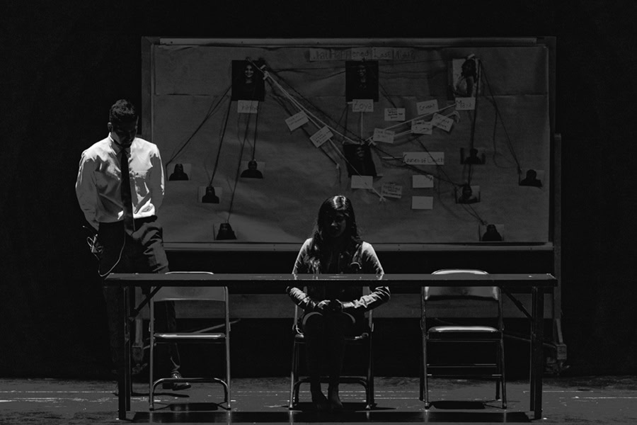 Netflix Documentaries for Crime Solving Addicts a Black and White Photo of a Woman Sitting at a Desk with a Board of Pictures and String Behind Her and a Man Standing Next to it