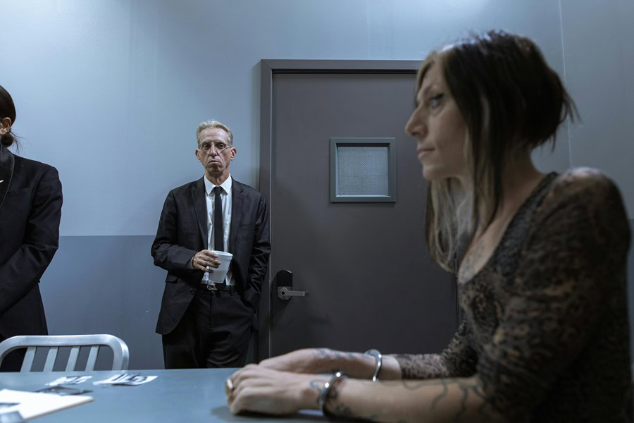 Netflix Documentaries for Crime Solving Addicts a Woman Being Interrogated by Two Detectives in a Room