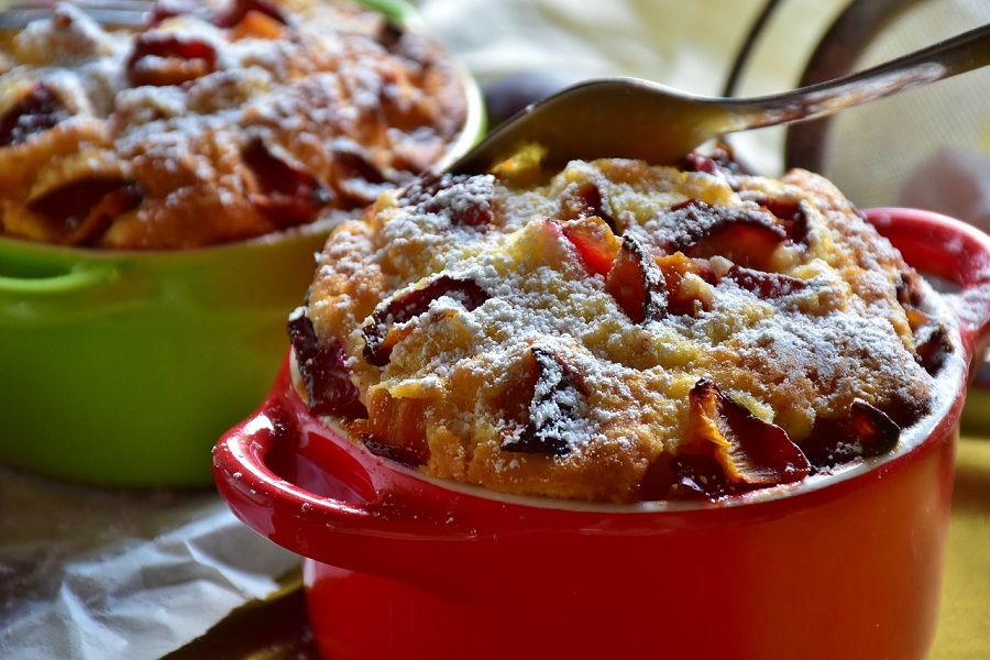 Things to Do on Christmas Morning Close Up of Two Single Servings of Fruit Cake in Red and Green Dishes