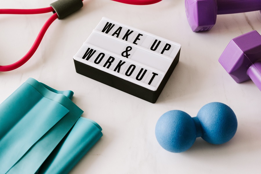 Ways to Lose 3 Pounds in 2 Days a Letterboard Sign That Says Wake Up & Workout Surrounded with Workout Gear