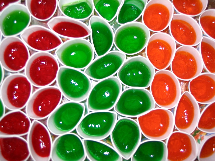 How to Make Jello Shots Quick Jello Shots in Red, Green and Orange Gathered Together in Little Paper Cups