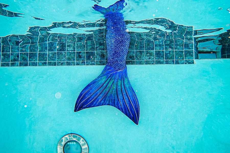 Mermaid Birthday Party Food Ideas Underwater View of a Mermaid Tail in a Pool