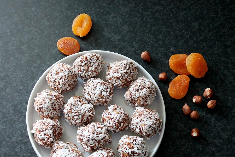 Healthy Oatmeal Balls Recipes for a Perfect Snacking Overhead View of a Plate of Oatmeal Balls with Orange slices Nearby