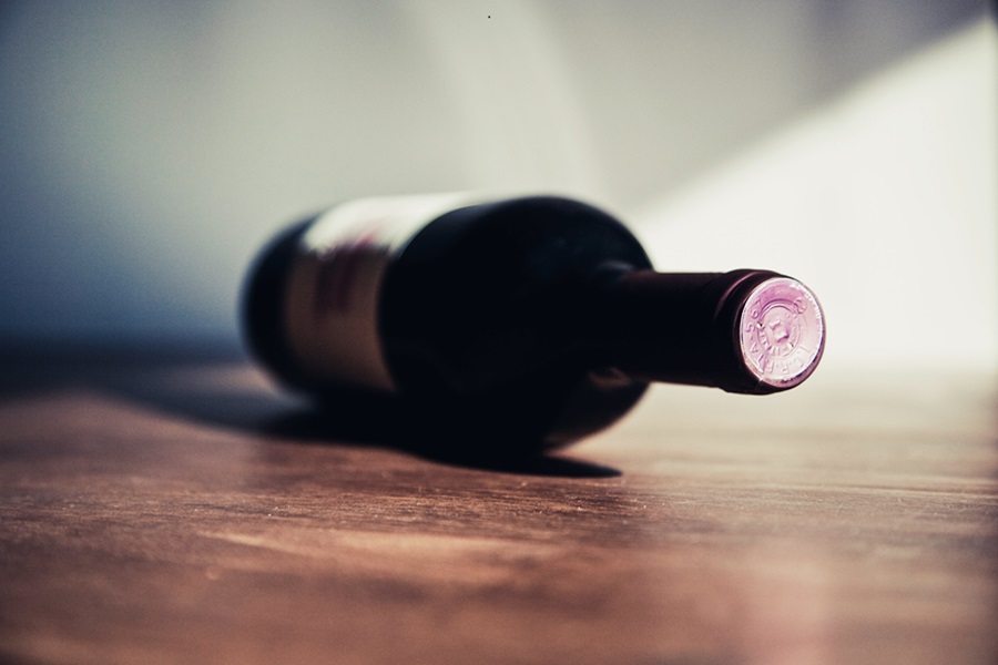 DIY Boozy Gifts for Wine Lovers a Wine Bottle Laying on Its Side