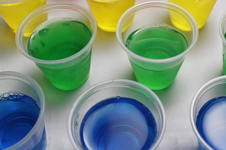 How to Make Jello Shots Come out Easier Close Up of Blue, Green and Yellow Jello Shots