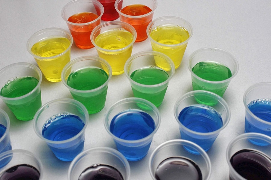 How to Make Jello Shots Come out Easier Different Colored Jello Shots Scattered Around