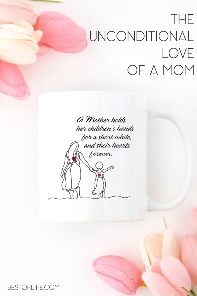 A mother holds her childrens hands for a short while coffee mug with flowers