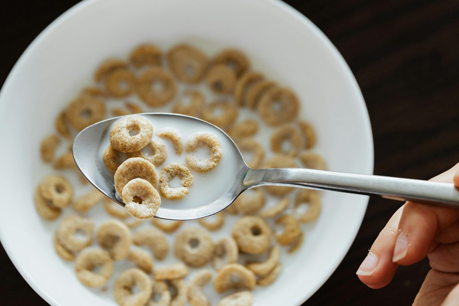 Be a Fruit Loop in a World of Cheerios Inspiration Close Up of a Bowl of Cheerios with a Spoon of Cheerios Hovering Above