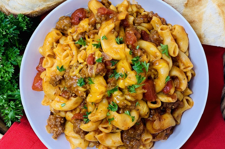 Pressure Cooker Beef Goulash Recipe in a bowl with bread
