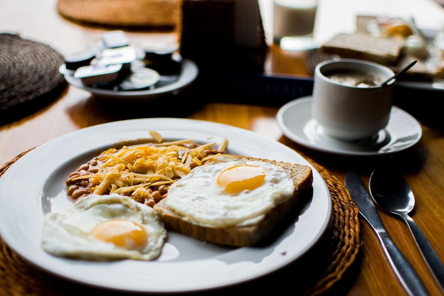 Best Breakfasts For Single Guys a Plate of Sunny Side Up Eggs on Toast with French Fries