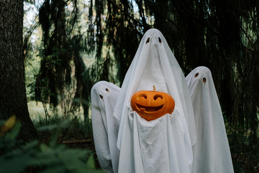 Halloween Party Recipes Three People Wearing Ghost Costumes With the One in the Center Holding a Pumpkin