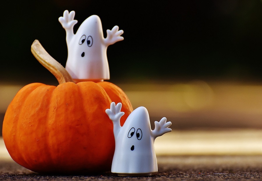 Instant Pot Halloween Recipes Two Small Ghost Figures on a Smaller Pumpkin