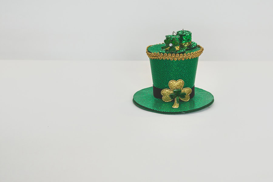Leprechaun Trap Ideas A Glittery Green Top Hat with a Clover as the Buckle and Four Leaf Clovers on Top