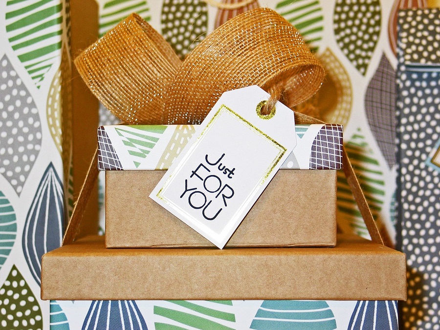 Unique Gifts Piled on Top of Each Other with a Tag