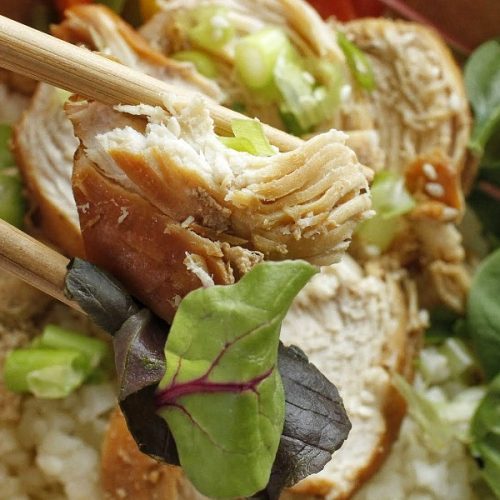 Whole30 Instant Pot Teriyaki Chicken Close Up of Chicken Being Held by Chopsticks