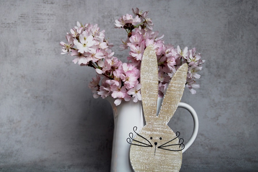 Baked Easter Ham Recipes to Impress a Wooden Bunny Face Next to a Pot of Flowers