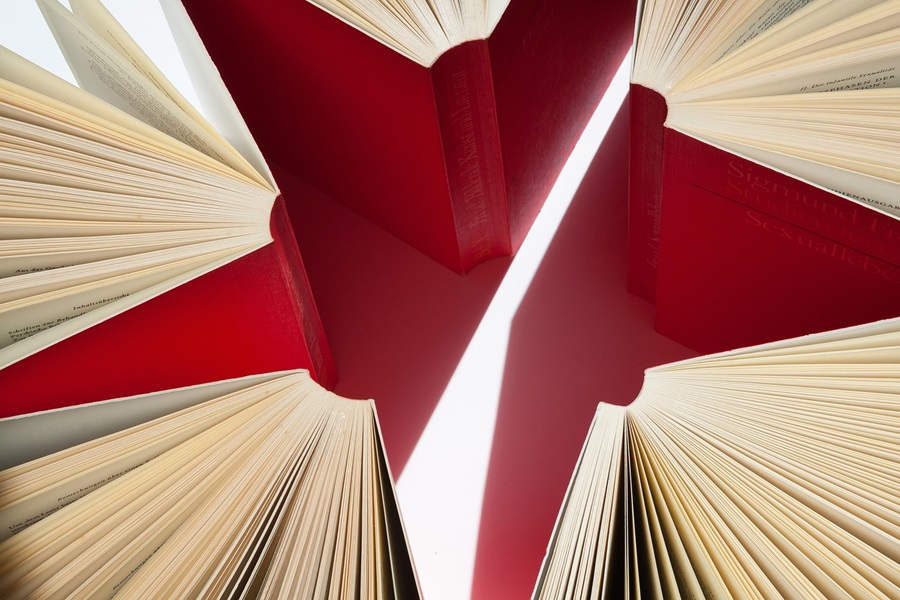 Best Netflix Series for Teens Close Up of Red Books Opened