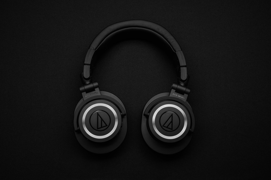 Best Netflix Series for Teens Close Up of Black Headphones on a Black Surface