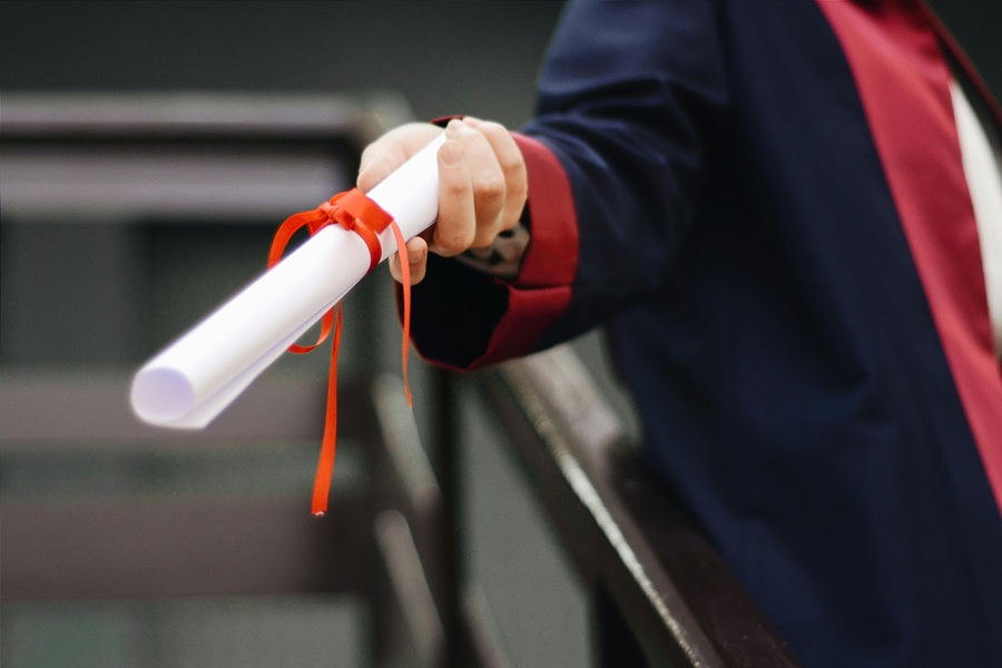 Graduation Quotes from Parents Close Up of a Person Handing Out a Diploma