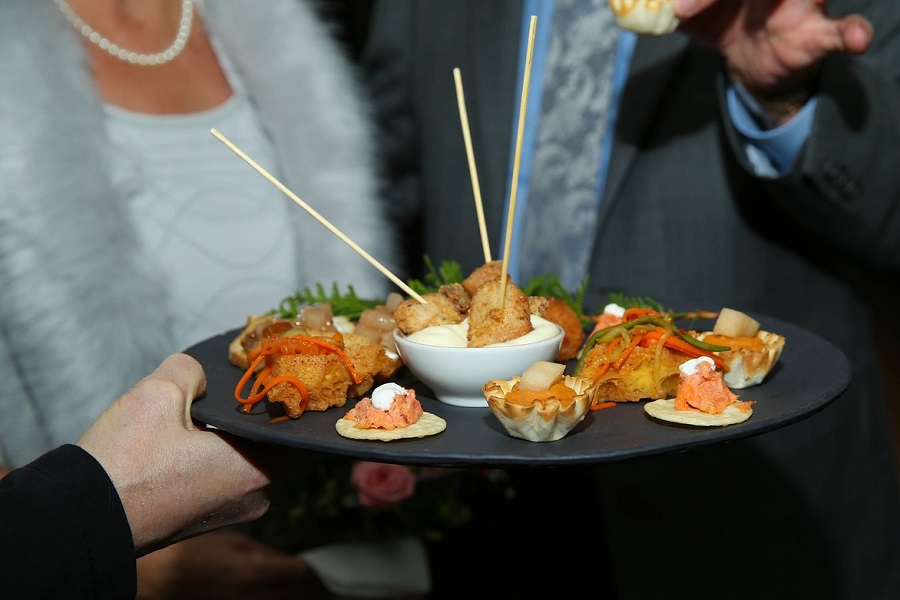 Party Food Platter Finger Food Ideas a Waitress at a Party Holding a Party Platter Serving Guests