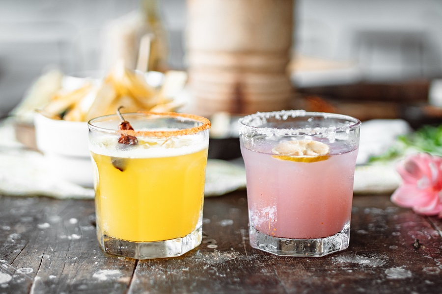 Tequila Drinks that Aren't Margaritas Two Cocktails on a Bar Top