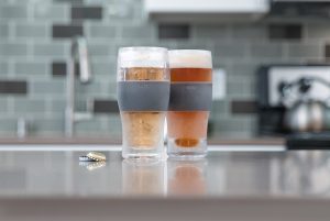 Two Freeze Cooling Pint Glasses on a Counter Top
