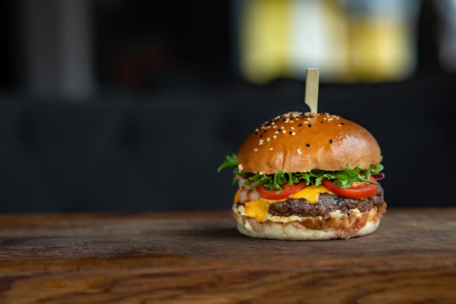 Beyond Meat Burger Recipes a Burger on a Wooden Table with a Toothpick Sticking Out From the Top