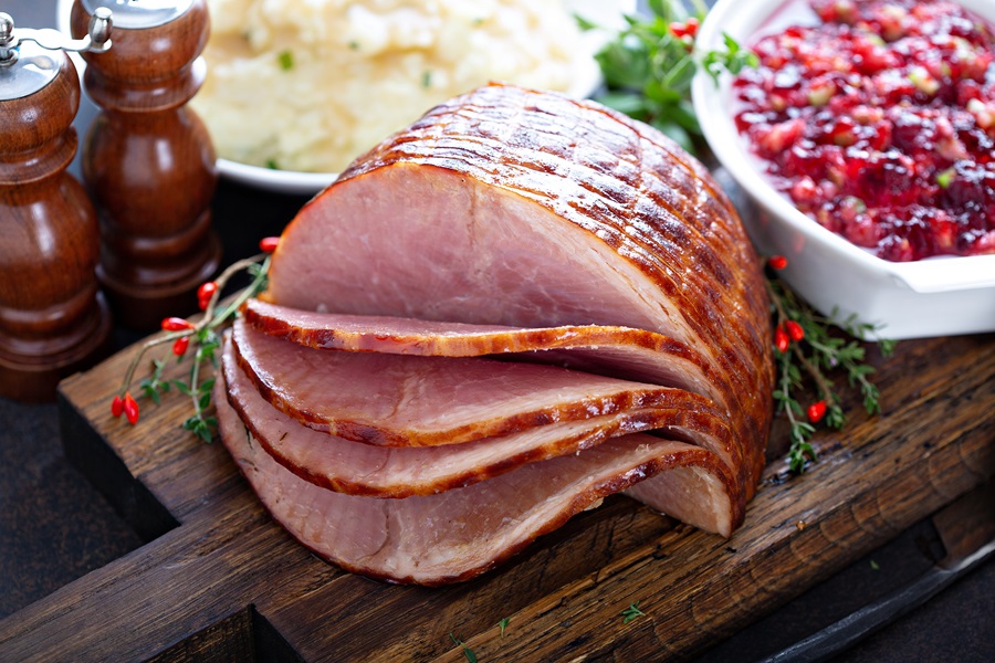 How to Cook A Ham Like A Pro a Ham on a Cutting Board with a Few Slices Cut Out