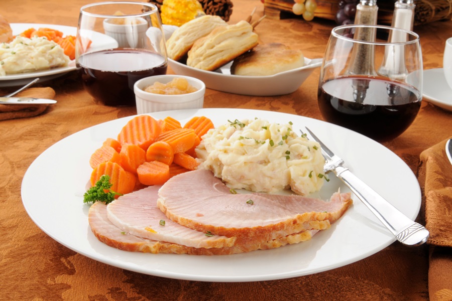 How to Cook A Ham Like A Pro a White Plate with Ham, Mashed Potatoes, and Carrots