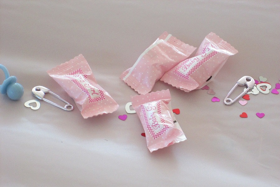 Baby Shower Ideas for Girls for a Memorable Baby Shower Close Up of Pink Candy Favors for a Baby Shower That Say "It's a Girl" on the Wrapper
