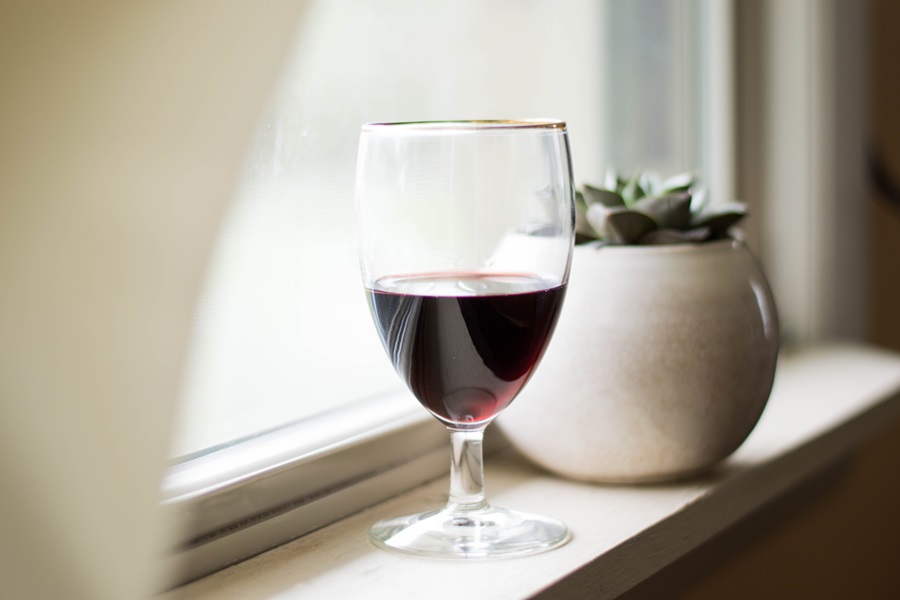 Best Red Wines Under $30 Close Up of a Wine Glass on a Window Sill