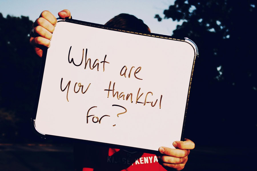Classic Thanksgiving Day Stuffing Recipes a Person Holding Up a Small White Board That Says What Are You Thankful For?