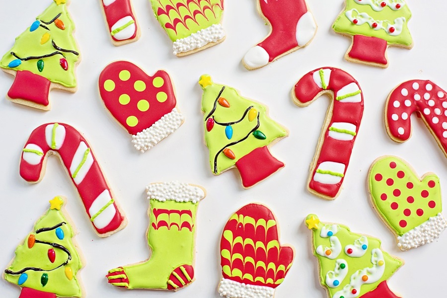 Holiday Cookie Recipes Sugar Cookies in Christmas Shapes Like Christmas Trees, Candy Canes, Mittens, and Stockings All with Colorful Icing