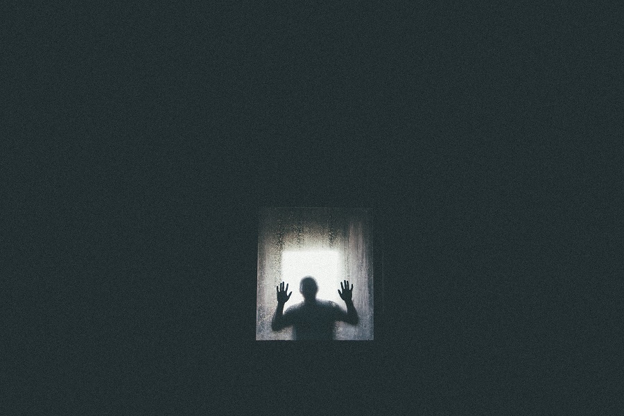 Scary Netflix Movies a Silhouette of a Person Looking in Through a Window in the Distance
