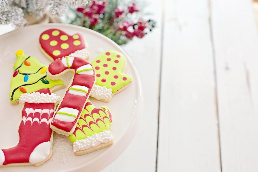 Free Christmas Printables Christmas Cookies Sitting on a Plate with Some Garland in the Background